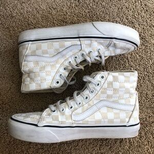 platformed checkered cream and white hightop vans